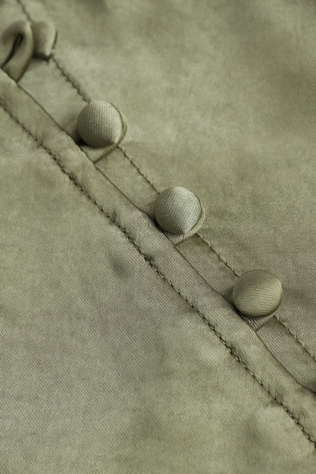 Decorative skirt with asymmetric hem and split button