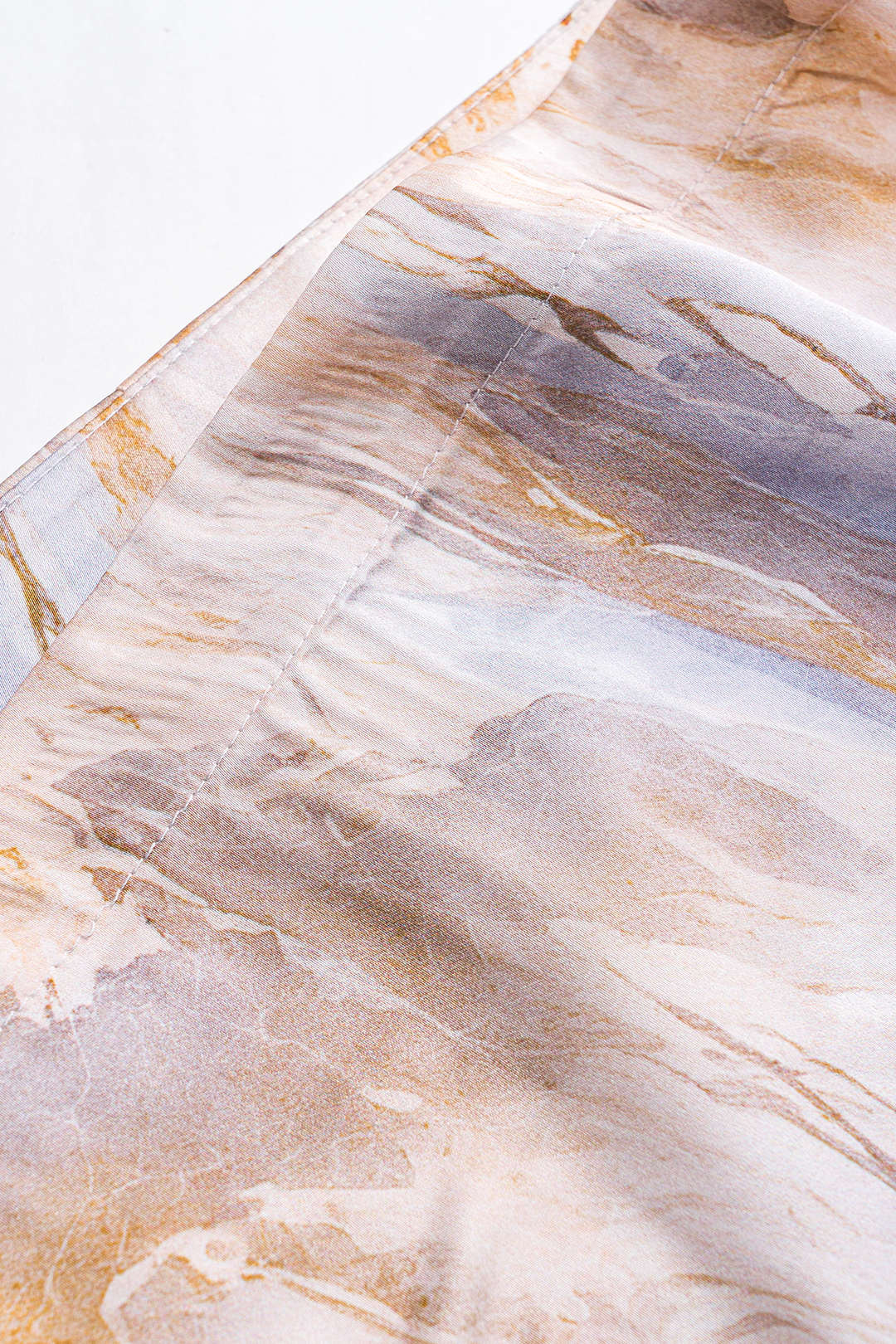 Abstract print pleated satin tie front skirt