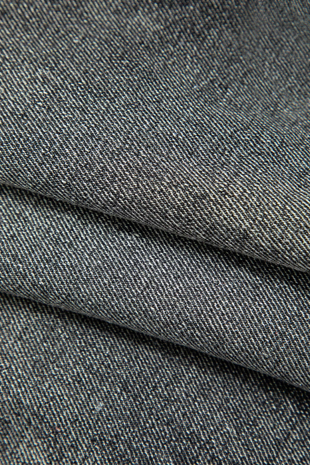 Asymmetrical cropped denim vest with button closure and flap pocket