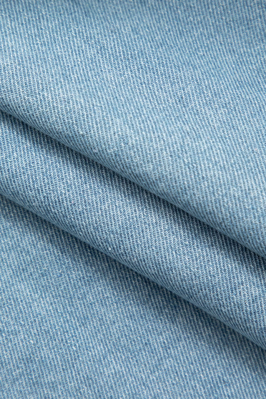 Asymmetrical cropped denim vest with button closure and flap pocket 